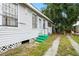 Side view of home with green painted steps and secure window bars at 3105 N 16Th St, Tampa, FL 33605