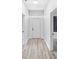 Hallway with modern floors, white trim, and natural lighting at 3105 N 16Th St, Tampa, FL 33605