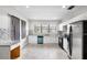 Modern kitchen featuring white cabinets, stainless steel appliances, and elegant granite countertops at 3105 N 16Th St, Tampa, FL 33605