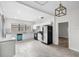 Spacious kitchen with white cabinets, stainless steel appliances, and a stylish pendant light at 3105 N 16Th St, Tampa, FL 33605