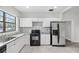 Well-equipped kitchen with stainless steel refrigerator, oven, granite countertops, and ample storage at 3105 N 16Th St, Tampa, FL 33605