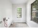 Neutral laundry room with gray tile flooring and access for washer and dryer hookups at 3105 N 16Th St, Tampa, FL 33605