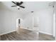 Bright living room featuring wood-look flooring and a modern ceiling fan at 3105 N 16Th St, Tampa, FL 33605