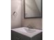 Powder room featuring gray vanity with chrome faucet and matching mirror at 3298 Covered Bridge W Dr, Dunedin, FL 34698