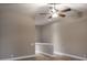 Upstairs bonus room features tile floors and a ceiling fan at 3298 Covered Bridge W Dr, Dunedin, FL 34698