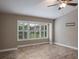 Bonus room with window, ceiling fan and tile floor at 3298 Covered Bridge W Dr, Dunedin, FL 34698
