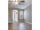 Bonus room features wood-look tile flooring, window and neutral paint at 3298 Covered Bridge W Dr, Dunedin, FL 34698