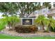 The entrance sign to the community of Covered Bridge Townhomes at 3298 Covered Bridge W Dr, Dunedin, FL 34698