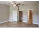 Main bedroom features tile floors and access to ensuite at 3298 Covered Bridge W Dr, Dunedin, FL 34698