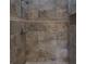 Spacious tiled shower with a large rain shower head, mosaic accent strip and convenient built-in niche at 3298 Covered Bridge W Dr, Dunedin, FL 34698