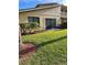 Well-maintained backyard with lush green lawn and landscaping at 3610 54Th W St # B8, Bradenton, FL 34209
