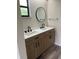 Bathroom featuring double sink vanity, black hardware and neutral color tones at 3610 54Th W St # B8, Bradenton, FL 34209