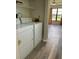 Convenient laundry area with washer, dryer, and storage shelves at 3610 54Th W St # B8, Bradenton, FL 34209