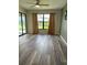 Bright living room with stylish gray flooring, neutral walls, and large windows at 3610 54Th W St # B8, Bradenton, FL 34209