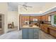 Spacious kitchen featuring ample cabinet space, granite counters, and a functional island at 3810 Darston St, Palm Harbor, FL 34685