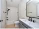 Well-lit bathroom featuring modern vanity, sleek fixtures, and a tub with a shower at 7001 Interbay Blvd # 121, Tampa, FL 33616