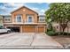 Townhome featuring private garages, balconies, and stone accents at 7001 Interbay Blvd # 121, Tampa, FL 33616