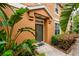 Charming home exterior with a welcoming front door, lush greenery, and manicured landscaping at 7001 Interbay Blvd # 121, Tampa, FL 33616