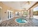 Relaxing hot tub area with shaded seating and a view of tropical landscaping at 7001 Interbay Blvd # 121, Tampa, FL 33616