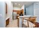 Charming kitchen featuring stainless steel appliances, tile flooring, and a breakfast bar with wooden stools at 7001 Interbay Blvd # 121, Tampa, FL 33616