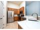 Charming kitchen featuring stainless steel appliances, wood cabinetry, and bright countertops at 7001 Interbay Blvd # 121, Tampa, FL 33616