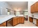 Open-concept kitchen featuring stainless appliances, light countertops and seamless flow to living area at 7001 Interbay Blvd # 121, Tampa, FL 33616