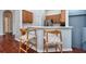 Inviting kitchen area featuring sleek stainless steel appliances and a breakfast bar with stylish wooden stools at 7001 Interbay Blvd # 121, Tampa, FL 33616