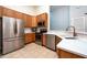 Well-equipped kitchen with stainless steel appliances, wooden cabinets, and modern countertops at 7001 Interbay Blvd # 121, Tampa, FL 33616