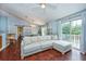 Bright living room featuring a comfortable sofa, natural light, and access to an outdoor balcony at 7001 Interbay Blvd # 121, Tampa, FL 33616