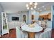 Open living space with modern lighting, a comfortable sofa, and a stylish dining area at 7001 Interbay Blvd # 121, Tampa, FL 33616