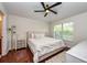 Comfortable main bedroom features a ceiling fan, large window, and plush carpeting at 7001 Interbay Blvd # 121, Tampa, FL 33616
