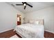 Inviting main bedroom boasting a large window, modern ceiling fan, and hard wood flooring at 7001 Interbay Blvd # 121, Tampa, FL 33616