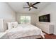 Bright main bedroom features a spacious layout, modern ceiling fan and a large window at 7001 Interbay Blvd # 121, Tampa, FL 33616