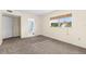The bedroom boasts plush carpet, a large window, and easy access to the bathroom at 840 Virginia St # 301, Dunedin, FL 34698
