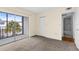Spacious bedroom with sliding glass door and access to ensuite bathroom at 840 Virginia St # 301, Dunedin, FL 34698