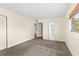 A well lit bedroom features neutral walls and plush carpet, perfect for comfort at 840 Virginia St # 301, Dunedin, FL 34698