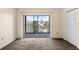 A bedroom with a sliding glass door to the porch and a closet, providing plenty of storage at 840 Virginia St # 301, Dunedin, FL 34698