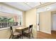 Dining area with table and chairs with a view of the outside at 840 Virginia St # 301, Dunedin, FL 34698