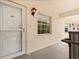 View of the condo hallway with door to unit 301 at 840 Virginia St # 301, Dunedin, FL 34698