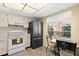 An updated kitchen features black stainless appliances and dining area at 840 Virginia St # 301, Dunedin, FL 34698