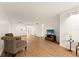 Bright living room featuring hardwood floors, and an open concept design at 840 Virginia St # 301, Dunedin, FL 34698