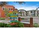 A vibrant town center entrance marked by colorful signs and a 'Defending Freedom' archway at 840 Virginia St # 301, Dunedin, FL 34698