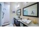 Modern bathroom featuring double vanity with vessel sinks, a shower with handrails and neutral paint at 878 Franklin Cir, Palm Harbor, FL 34683