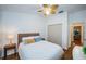 Comfortable bedroom with neutral tones, features closet, and bright window with natural light at 878 Franklin Cir, Palm Harbor, FL 34683
