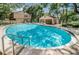 Inviting community pool with clear blue water, surrounded by lounge chairs and shaded areas at 878 Franklin Cir, Palm Harbor, FL 34683