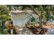 Charming single-story home with a one-car garage and a well-maintained, tree-lined yard and brick-lined driveway at 878 Franklin Cir, Palm Harbor, FL 34683