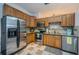 Kitchen featuring stainless steel appliances, granite countertops, and tile backsplash at 878 Franklin Cir, Palm Harbor, FL 34683