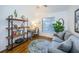Inviting home office featuring a desk, comfortable seating, and ample natural light from a bright window at 878 Franklin Cir, Palm Harbor, FL 34683