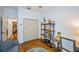 Bright office space featuring a large closet and a wood bookshelf alongside a cozy seating area at 878 Franklin Cir, Palm Harbor, FL 34683