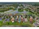 A beautiful aerial view of this home with a screened in pool in a tranquil lakeside community at 20115 Nob Oak Ave, Tampa, FL 33647